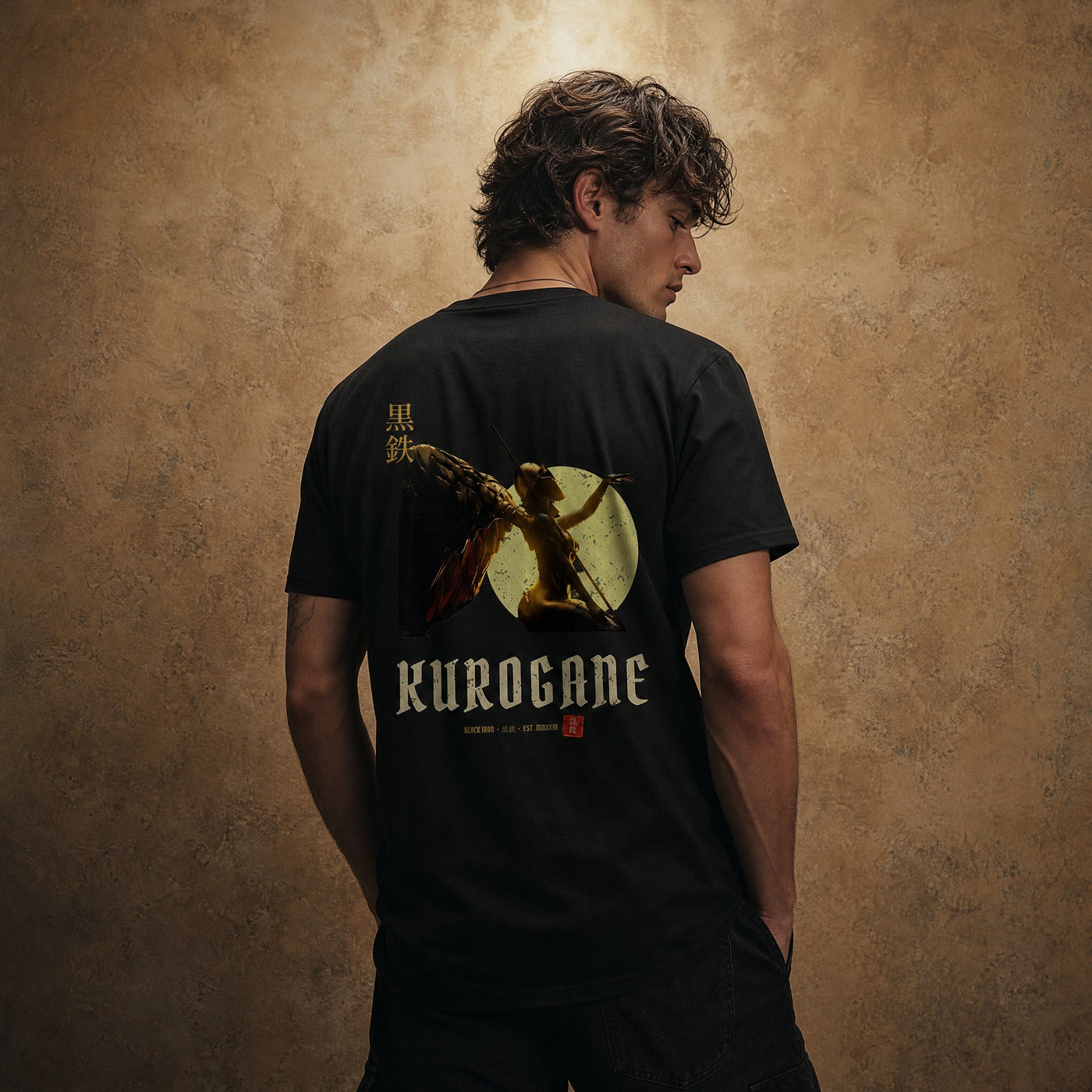 KUROGANE VALKYRIE oversized tee on model, warm gold wall portrait